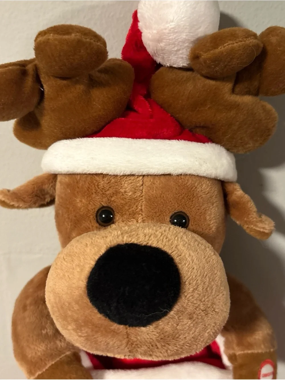 Holiday singing stocking with puppy dog sings jingle bells
